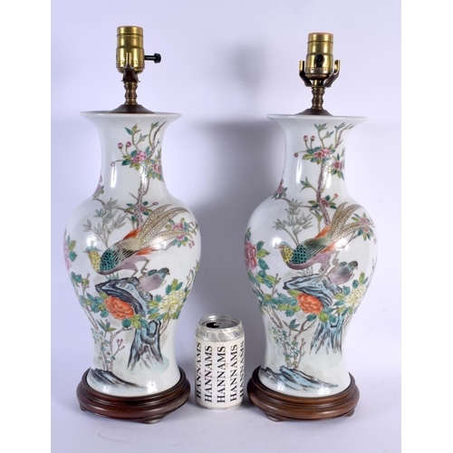 1797 - A PAIR OF CHINESE REPUBLICAN PERIOD FAMILLE ROSE PORCELAIN LAMPS painted with birds and flowers. 48 ... 