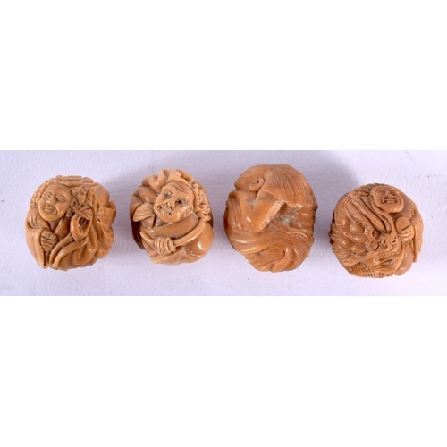 1809 - FOUR JAPANESE CARVED TAGHUA NUT NETSUKES. 68 grams. 4 cm x 3.25 cm. (4)