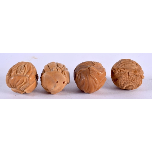 1809 - FOUR JAPANESE CARVED TAGHUA NUT NETSUKES. 68 grams. 4 cm x 3.25 cm. (4)