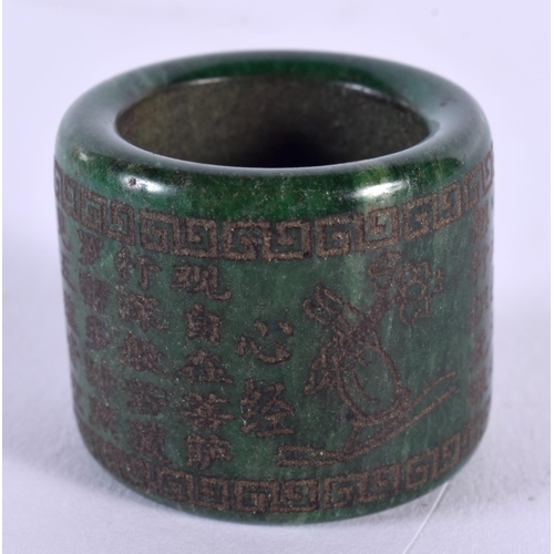 1816 - A CHINESE CARVED JADE ARCHERS RING 20th Century. 37 grams. 4 cm wide.