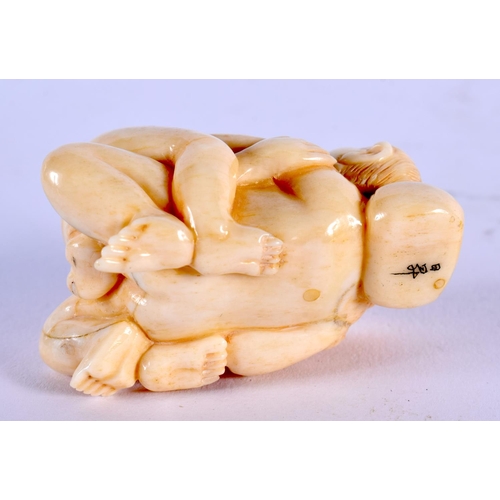 1824 - A JAPANESE CARVED BONE EROTIC FIGURE. 51 grams. 5.25 cm x 3.5 cm.