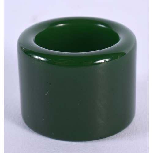 1841 - A CHINESE GREEN JADE ARCHERS RING 20th Century. 28 grams. 4 cm wide.