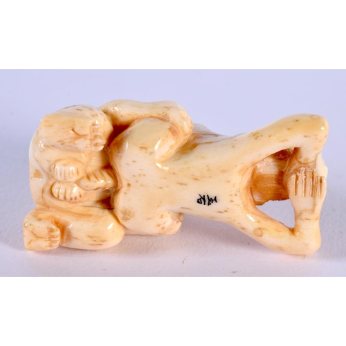 1848 - A JAPANESE CARVED BONE EROTIC NETSUKE. 29 grams. 5.5 cm x 3 cm.