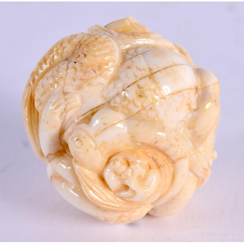 1865 - A JAPANESE CARVED BONE FIGURAL BALL. 37 grams. 3.5 cm wide.