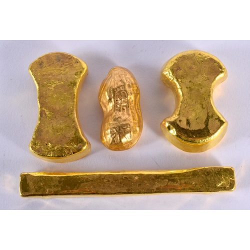 1872 - FOUR CHINESE YELLOW METAL INGOTS 20th Century. 499 grams. Largest 12 cm x 3.5 cm. (4)