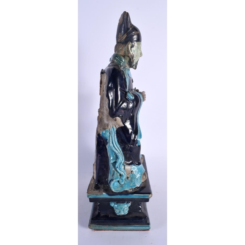 1873 - A RARE LARGE 16TH/17TH CENTURY CHINESE FAHUA POTTERY FIGURE OF AN IMMORTAL Ming/Qing, modelled with ... 