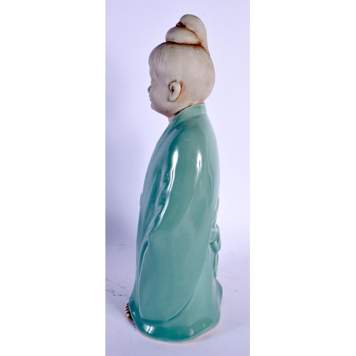 1900 - AN UNUSUAL EARLY 20TH CENTURY JAPANESE TAISHO PERIOD CELADON PORCELAIN FIGURE modelled as a young bo... 