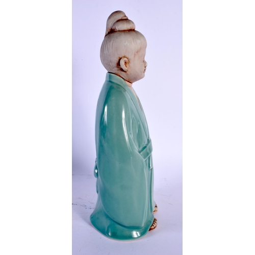 1900 - AN UNUSUAL EARLY 20TH CENTURY JAPANESE TAISHO PERIOD CELADON PORCELAIN FIGURE modelled as a young bo... 