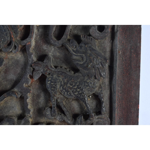 1938 - A 17TH/18TH CENTURY CHINESE CARVED HARDWOOD PANEL Ming/Qing, depicting buddhistic beasts amongst fol... 