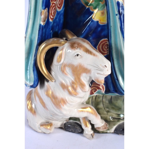 1943 - A LARGE 19TH CENTURY JAPANESE AO KUTANI PORCELAIN FIGURE modelled as a male with goat. 32 cm high.