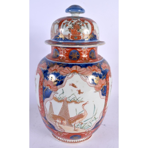 1948 - A LARGE 19TH CENTURY JAPANESE MEIJI PERIOD IMARI VASE AND COVER painted with assorted scenes. 32 cm ... 