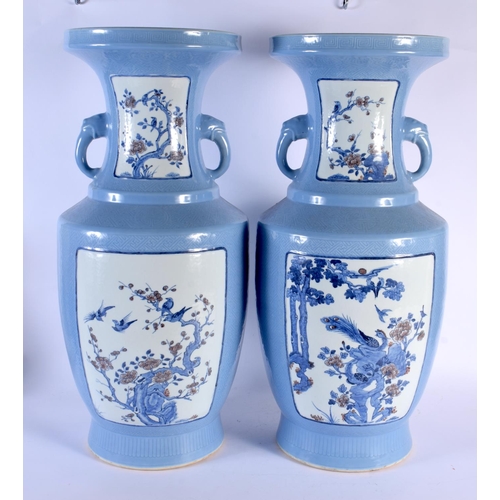 1950 - A LARGE PAIR OF CHINESE CLARE DU LUNE TWIN HANDLED PORCELAIN VASES probably 19th century, painted wi... 