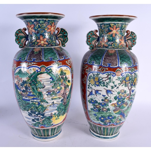 1971 - A LARGE PAIR OF 19TH CENTURY JAPANESE MEIJI PERIOD AO KUTANI PORCELAIN VASES painted with birds and ... 