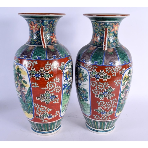 1971 - A LARGE PAIR OF 19TH CENTURY JAPANESE MEIJI PERIOD AO KUTANI PORCELAIN VASES painted with birds and ... 