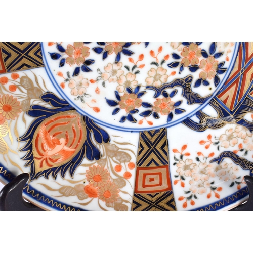 1979 - A LARGE 19TH CENTURY JAPANESE MEIJI PERIOD IMARI PLATE painted with flowers. 34 cm wide.