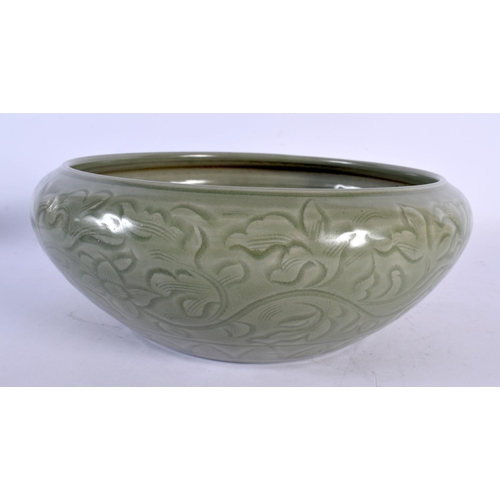 1980 - A CHINESE QING DYNASTY CELADON INCISED STONEWARE CENSER Ming style. 24 cm x 10 cm.