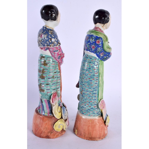 1982 - A PAIR OF EARLY 20TH CHINESE FAMILLE ROSE PORCELAIN FIGURES Late Qing/Republic. 26 cm high.