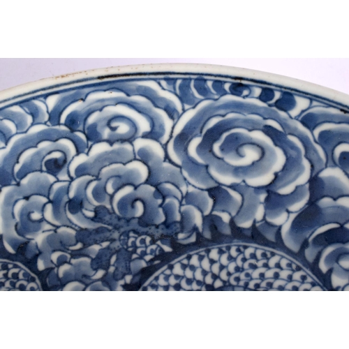 1998 - A LARGE 19TH CENTURY CHINESE BLUE AND WHITE PORCELAIN DRAGON DISH Qing. 27 cm diameter.