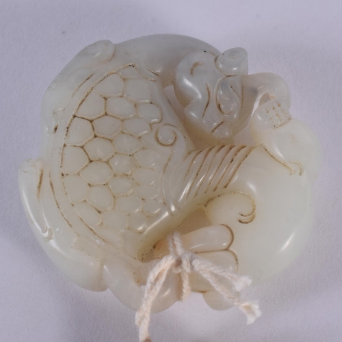 2006 - A CHINESE CARVED JADE ROUNDEL 20th Century. 5 cm wide.