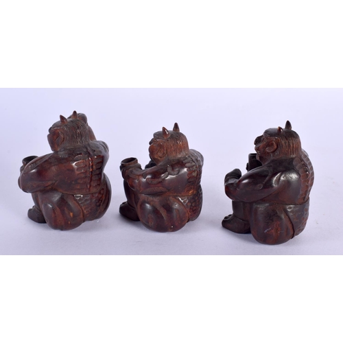 2015 - THREE 19TH CENTURY JAPANESE MEIJI PERIOD CARVED WOOD ONI OKIMONO. 7.5 cm x 5.5 cm. (3)