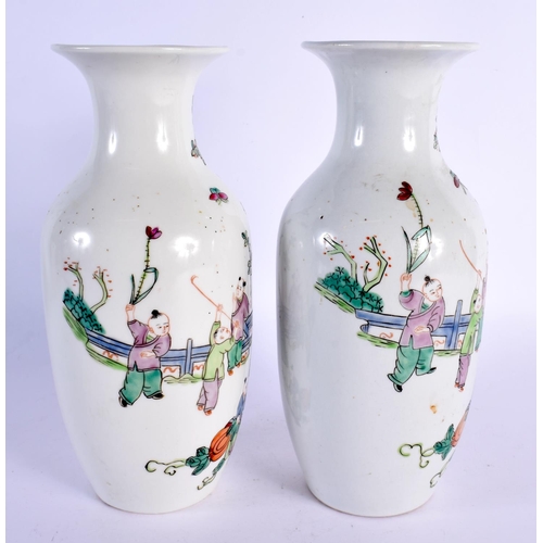 2022 - A PAIR OF CHINESE FAMILLE ROSE PORCELAIN VASES 20th Century, painted with boys in landscapes. 24 cm ... 