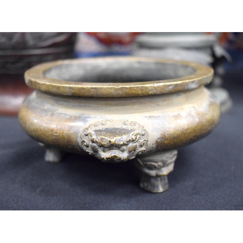 2434 - A CHINESE BRONZE CENSER 20th Century. 15 cm wide.