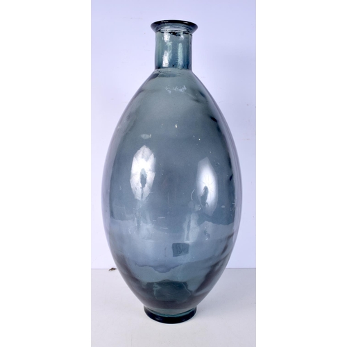 3005 - A large blue glass vase 59 cm.