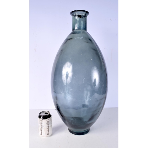 3005 - A large blue glass vase 59 cm.