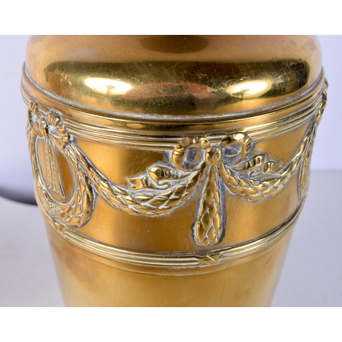 3014 - A pair of Arts and Crafts Brass vases embossed with ribbons and wreaths 26 cm (2)