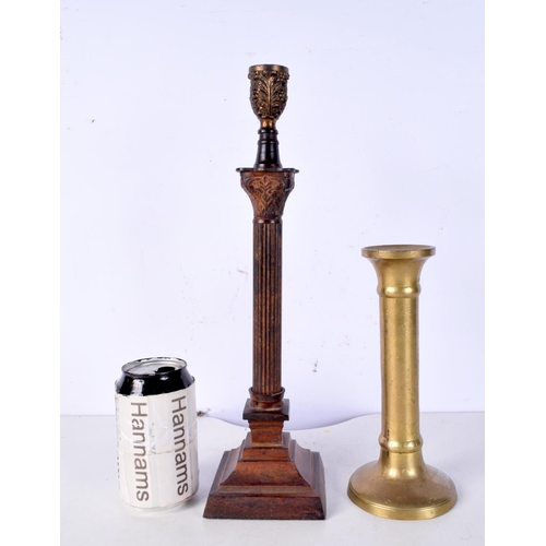 3023 - A brass candlestick possibly 18th Century together with a metal column style lampstand 36.5 cm (2).