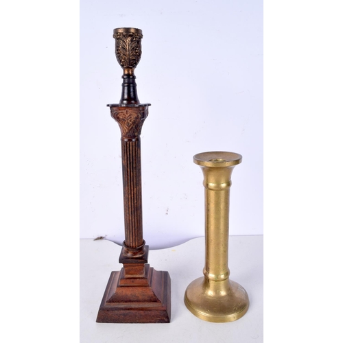 3023 - A brass candlestick possibly 18th Century together with a metal column style lampstand 36.5 cm (2).