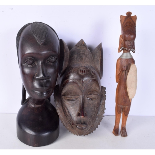 3052 - A large carved ebony African tribal head together with a Congolese wooden tribal  mask and another f... 