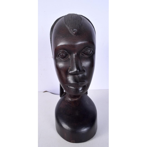 3052 - A large carved ebony African tribal head together with a Congolese wooden tribal  mask and another f... 