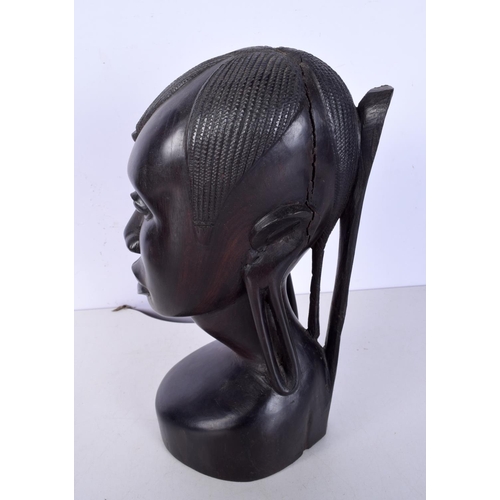 3052 - A large carved ebony African tribal head together with a Congolese wooden tribal  mask and another f... 