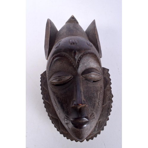 3052 - A large carved ebony African tribal head together with a Congolese wooden tribal  mask and another f... 