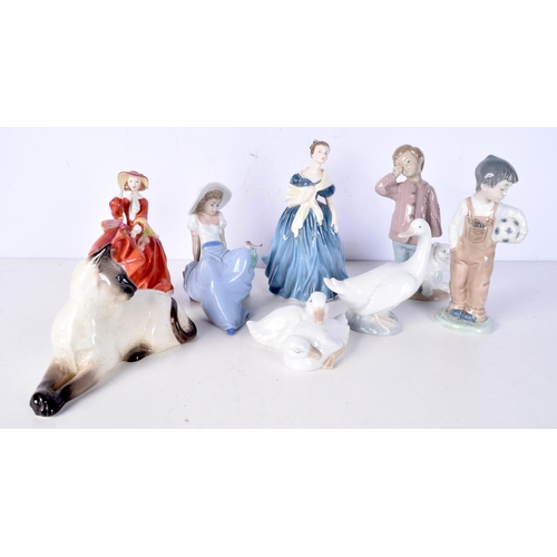 3053 - A collection of ceramic figures including a Beswick Cat, Nao, Royal Doulton largest 21 cm.(8).