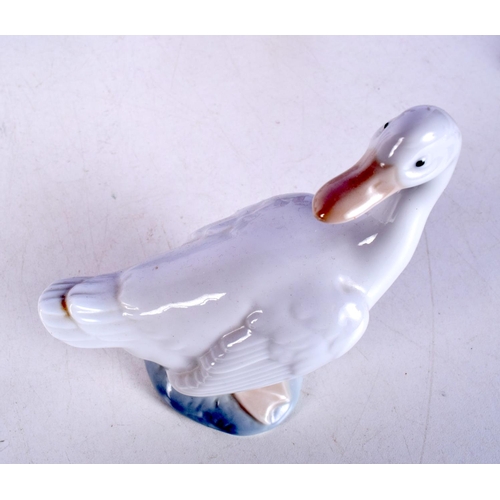 3053 - A collection of ceramic figures including a Beswick Cat, Nao, Royal Doulton largest 21 cm.(8).