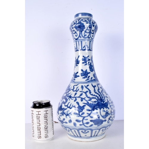 3058 - A Chinese porcelain blue and white garlic head vase decorated with Dragon and Phoenix 38cm.