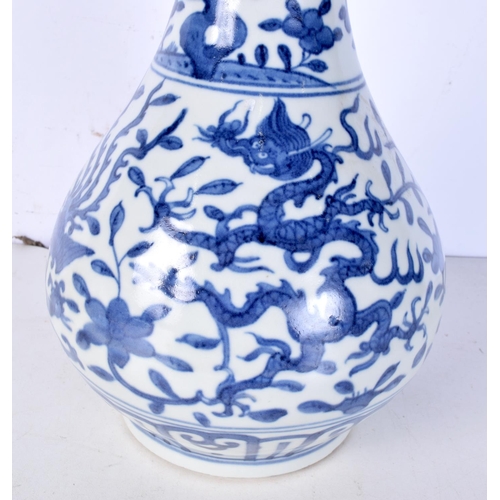 3058 - A Chinese porcelain blue and white garlic head vase decorated with Dragon and Phoenix 38cm.