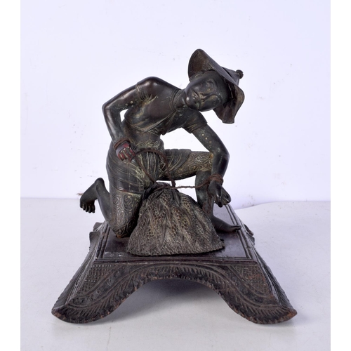 3060 - A 19th Century Japanese bronze figure of a field worker mounted on a carved wooden stand 11cm