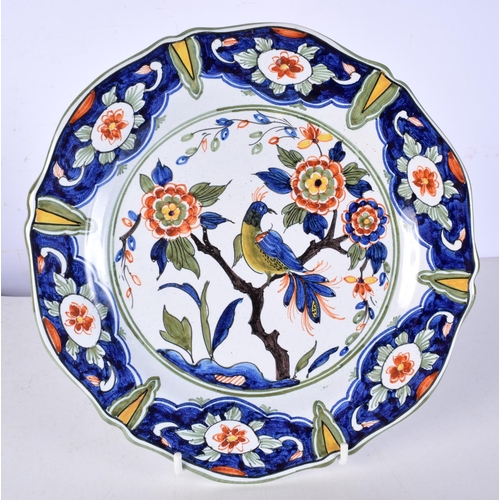 3074 - A Delft glazed plate decorated with birds in a tree together with a Davenport plate decorated with b... 