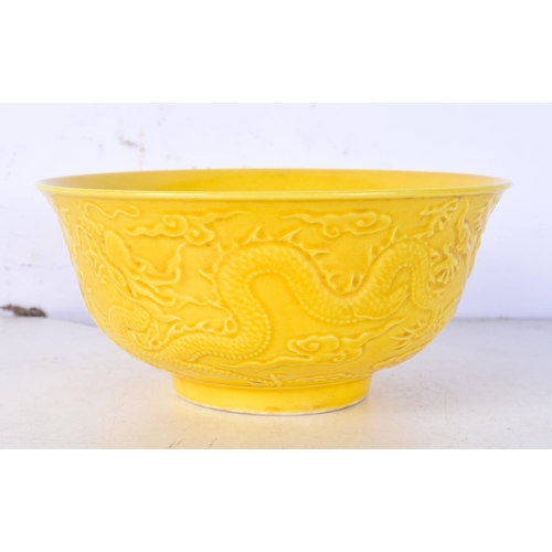 3091 - A Chinese porcelain  yellow ground bowl decorated in relief with Dragon 7 x 15.5 cm.