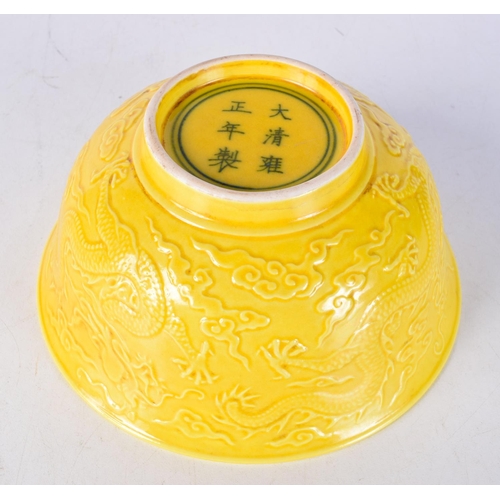 3091 - A Chinese porcelain  yellow ground bowl decorated in relief with Dragon 7 x 15.5 cm.