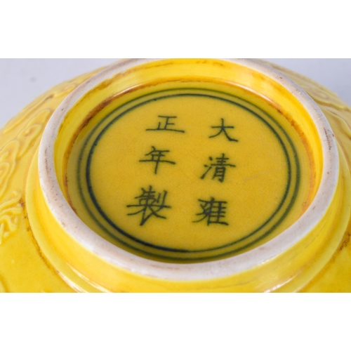 3091 - A Chinese porcelain  yellow ground bowl decorated in relief with Dragon 7 x 15.5 cm.