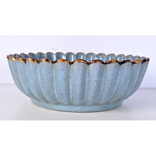 3100 - A Chinese porcelain petal shaped crackle glazed bowl decorated with Calligraphy 8 x 23 cm.