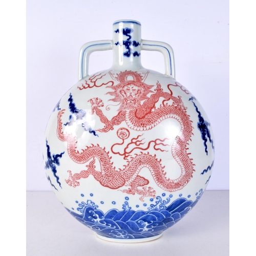 3104 - A Chinese porcelain Moon flask decorated with a dragon 34 cm.