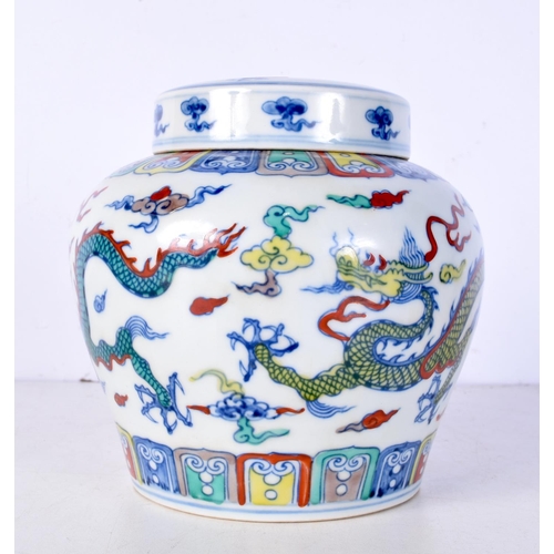 3105 - A Chinese porcelain polychrome Ginger jar decorated with Dragons 14 cm.