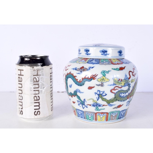 3105 - A Chinese porcelain polychrome Ginger jar decorated with Dragons 14 cm.