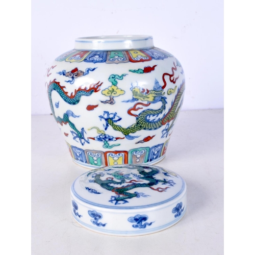 3105 - A Chinese porcelain polychrome Ginger jar decorated with Dragons 14 cm.