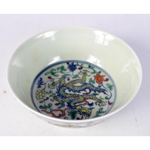 3107 - A small Chinese porcelain polychrome dragon bowl 5 x 14 cm.